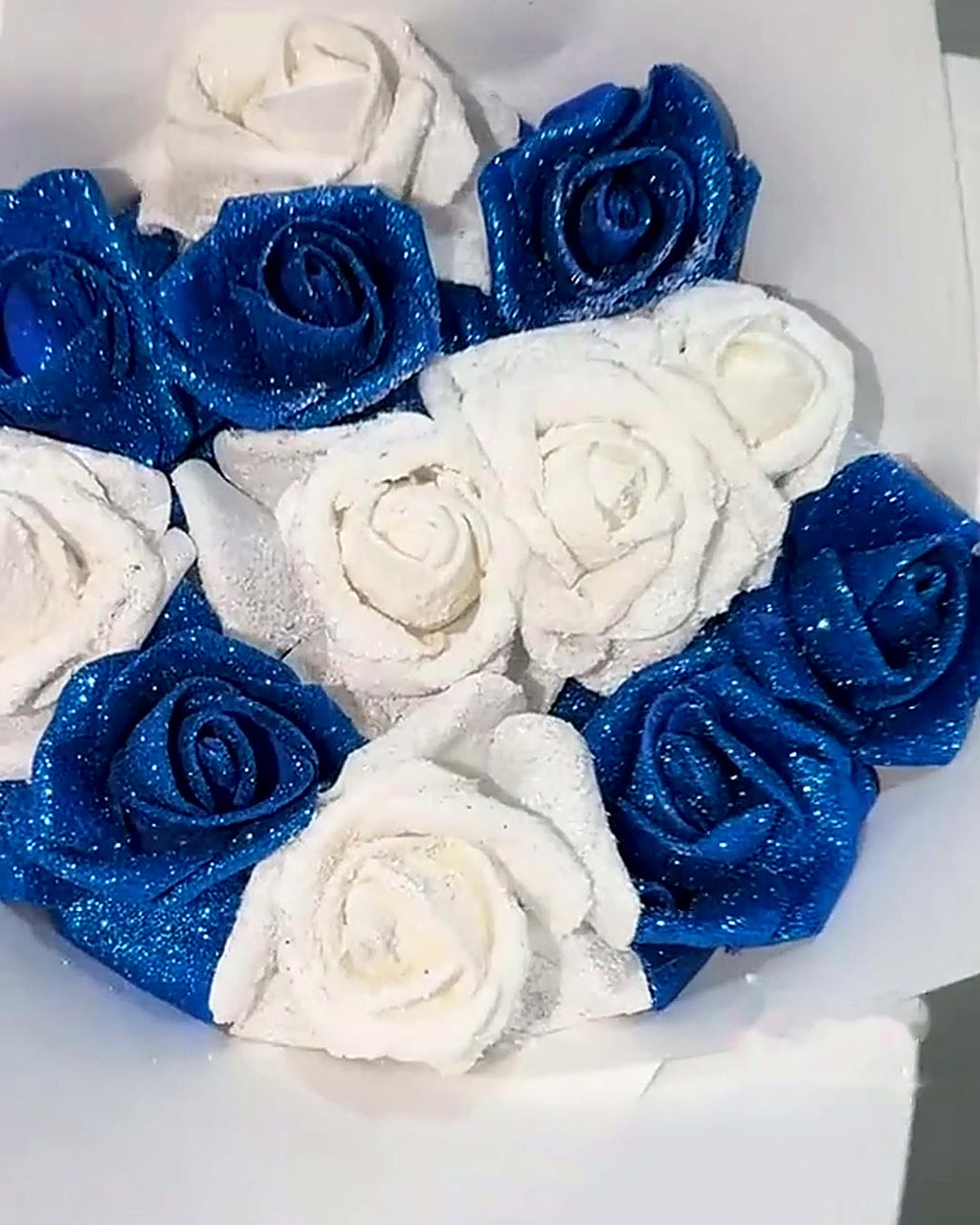 Close-up of blue and white glitter roses