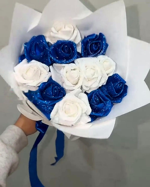 Blue and White Glitter Rose Bouquet in white wrap with royal blue satin ribbon