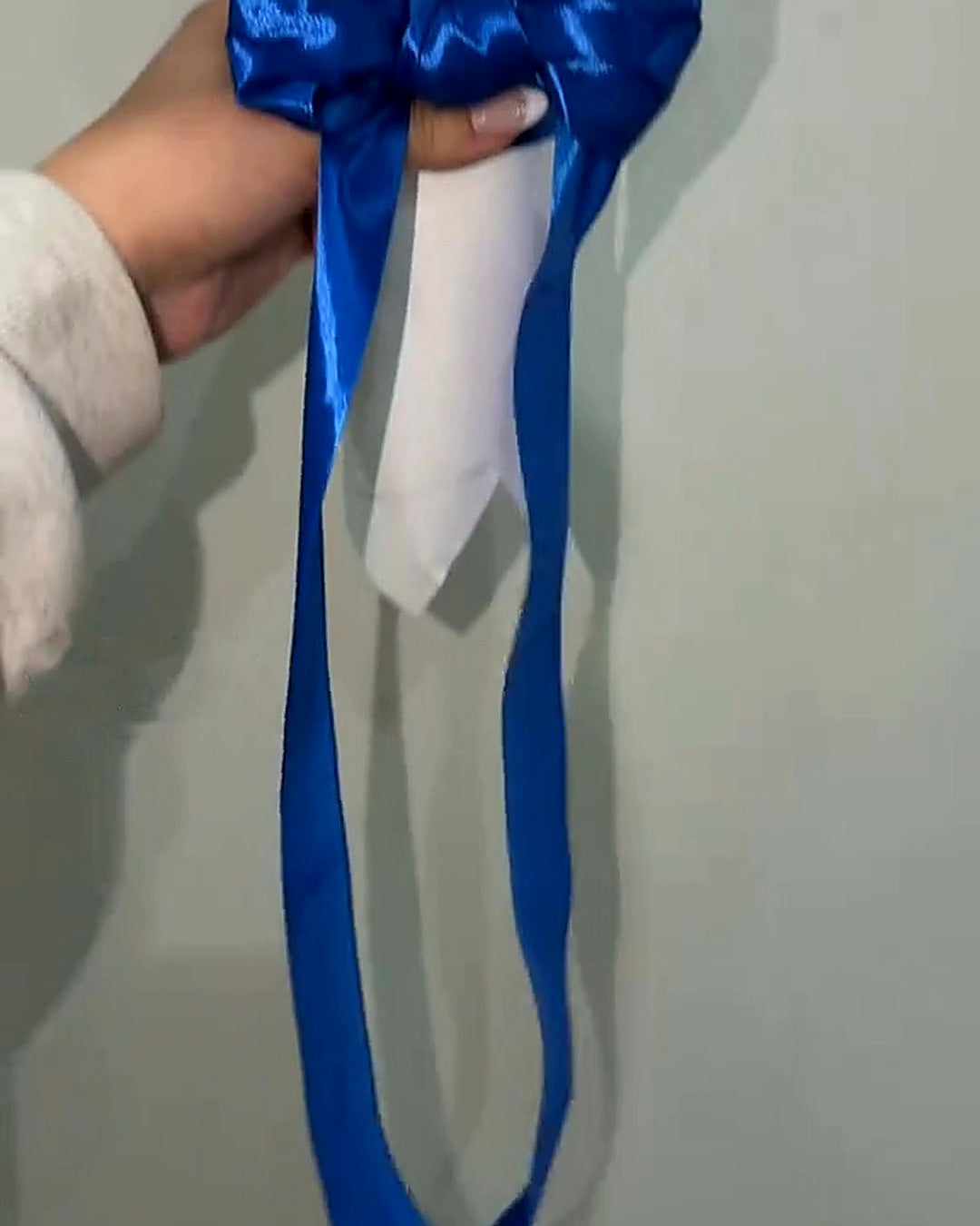 Royal blue satin ribbon on the Blue and White Glitter Rose Bouquet